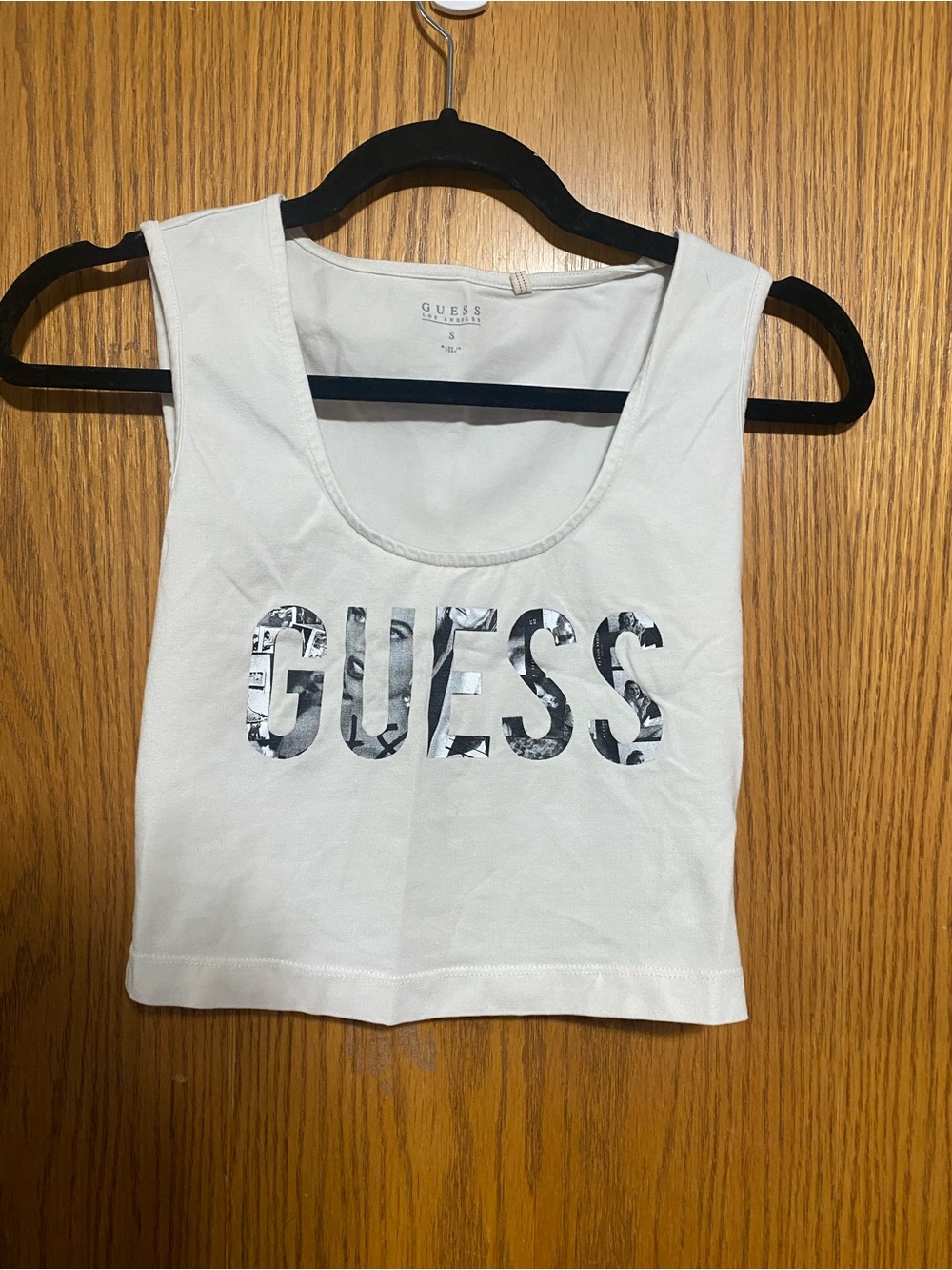 GUESS White Logo Crop Tank Top with pictures in the lettering
